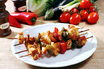 Various types of fish with shrimp on skewers