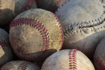 Old baseball balls close up background