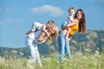 Fototapeta premium Women with there children are relaxing in nature