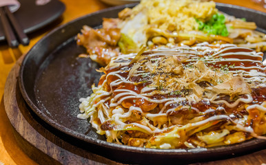 Closeup Cooking Okonomiyaki or japan pizza 