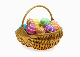 Easter basket with eggs over white