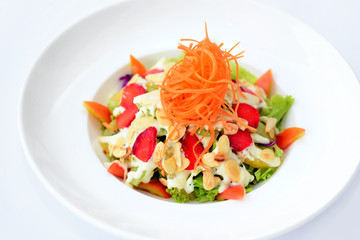 Mixed fruits salad on white plate