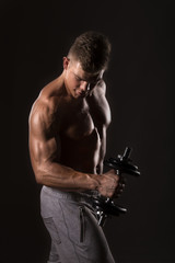 Fototapeta na wymiar muscle bodybuilder lifting weight