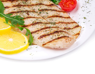 Grilled fish fillet with vegetables.