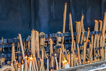 Sanctuary of Fatima. Votive candles burning in the pyre - obrazy, fototapety, plakaty