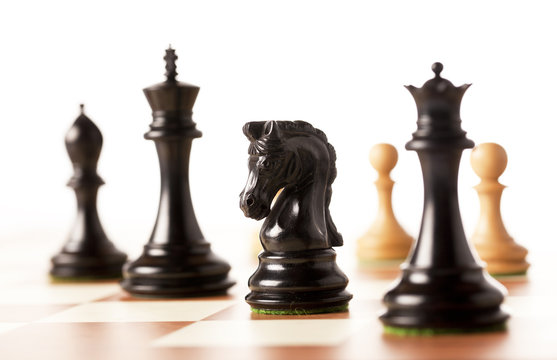 black chess pices on a chessboard