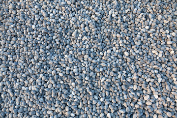Pebbles on the beach as background