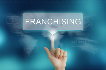 hand clicking on franchising button