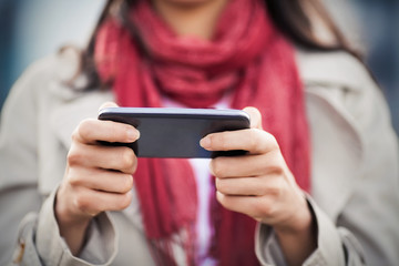 Close-up of mobile phone in women's hands