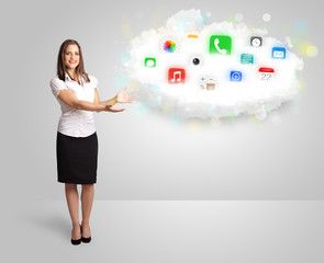 Young woman presenting cloud with colorful app icons and symbols