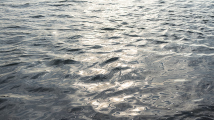 Rippled water in river with sun flecks
