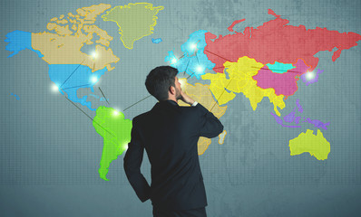 businessman drawing map on wall