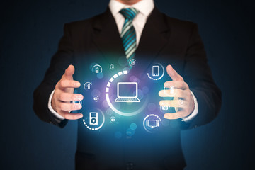 holding digital media icons