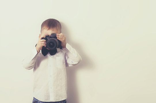 a little boy with a camera