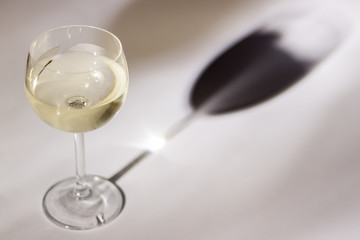 Glass of white wine -white background