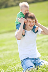 Fototapeta premium Father with son are playing in nature 