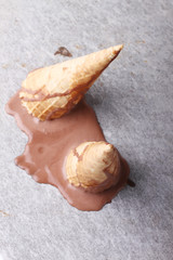 chocolate ice cream cones dropped melt on ground