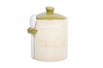 Ceramic jar for spices with a spoon on a white background