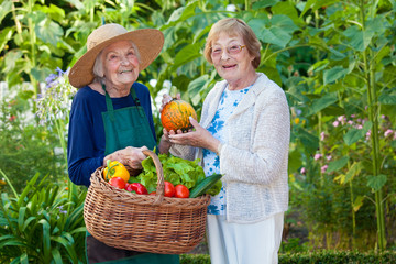 Two Senior Women at the Farm with Fresh Vegetables