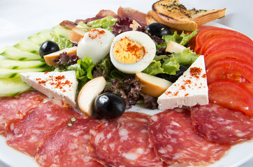 appetizer, entree of bacon, eggs and vegetables