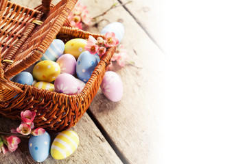 Easter decoration: colorful eggs in basket