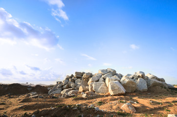 Barren landscape with hill of rock boulder stone