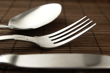 Cutlery on a wooden background.
