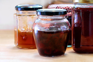 jars with various homemade fruit jam