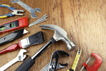 Assorted tools on wood