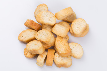 Fototapeta na wymiar White bread croutons on a white background