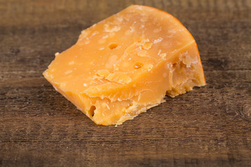 Italian Parmesan Cheese on Wooden Background