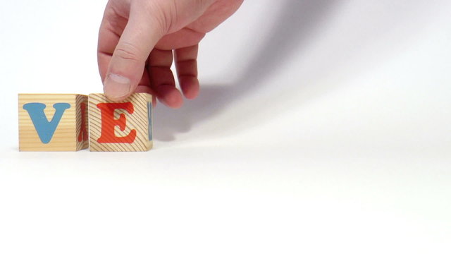 The video shows vector word built of wooden blocks