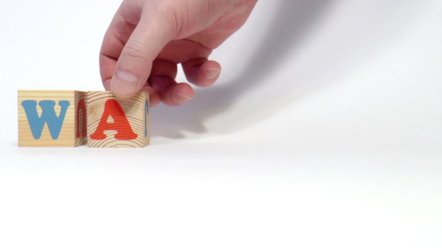 The video shows wanted word built of wooden blocks