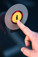Hand pressing information button