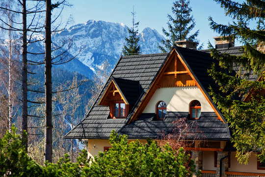 Guesthouse and mountain snowy landscape horizon