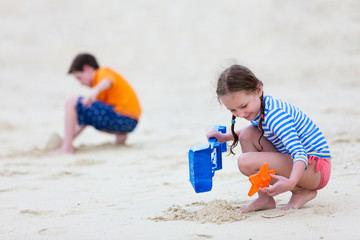 Two kids playing at beach