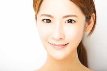 Fototapeta premium closeup smiling young woman face