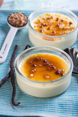 serving homemade creme brulee with cane sugar and fresh vanilla