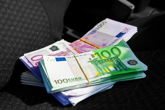 macro photo of a pack of money EUR on a car seat