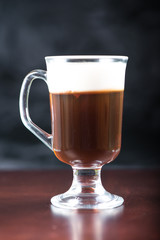 traditional strong irish coffee on wooden bar