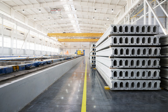 Stack of reinforced concrete slabs in a factory workshop