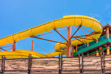 The yellow water slider at outdoor amusement park