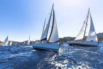 Fototapeta premium Sailing in the wind through the waves at the Aegean Sea.