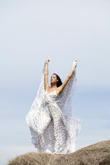 Beautiful young woman in white sexy dress