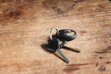 car keys on a wooden floor