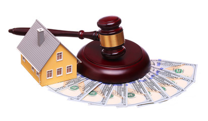 Concept of house sale with gavel and money isolated
