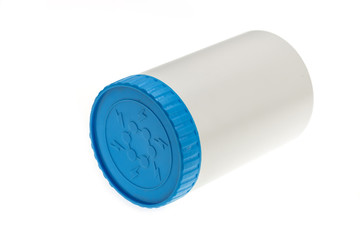 White plastic medicine bottle with blue cap