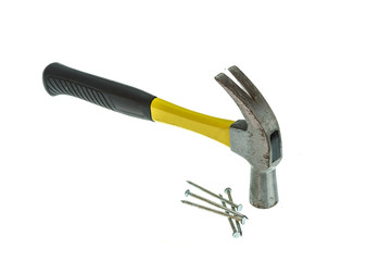 Old hammer with nail isolated on white