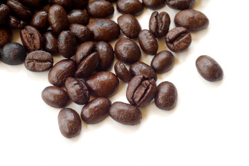 Brown coffee beans isolated on white background