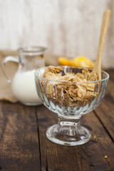 muesli with a bowl and milk in a jug